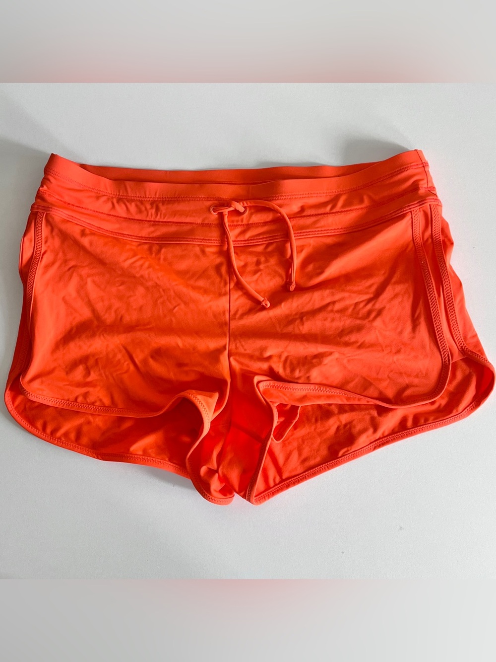 Athleta surge swim shorts womens small orange lined bottom stretchy surf board